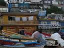 Fishing boats on the beach and hillside homes in Horcon.